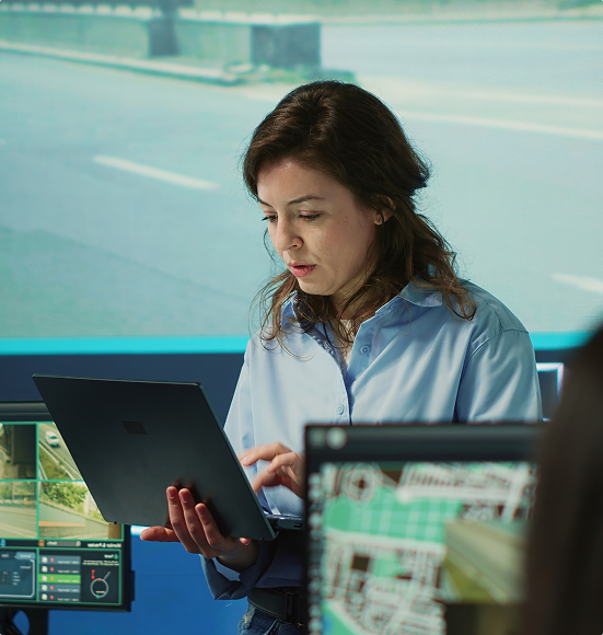 Security monitoring professional working across multiple screens